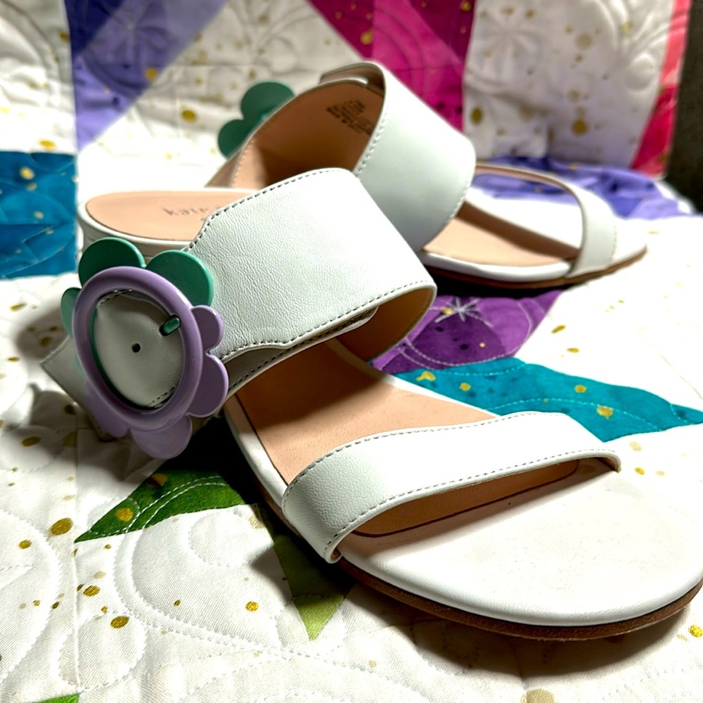 Size 6.5 Kate Spade sandals white with Turquoise and purple flower buckle.